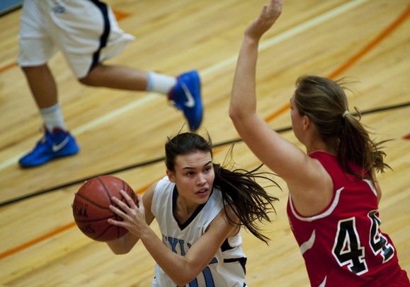 Skyline High School senior Tori Norris looks to pass in the first quarter against Whitmore Lake on Friday. Skyline won 55-32. Daniel Brenner I AnnArbor.com